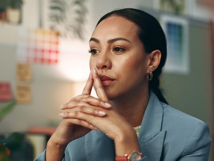 Night, office and business woman thinking, planning and reading solution, research or project idea. Working, late and face of female designer with questions, why or decision, solution or choice doubt psychology of decision making