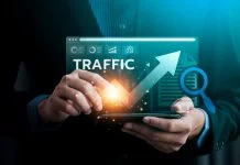 Digital Traffic Growth Analysis, Business Professional Using Advanced Technology to Monitor and Enhance Website Performance for Increased Traffic and Online Visibility in a Competitive Market