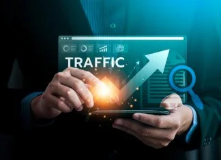 Digital Traffic Growth Analysis, Business Professional Using Advanced Technology to Monitor and Enhance Website Performance for Increased Traffic and Online Visibility in a Competitive Market