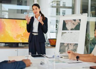 Why Should the Private Sector Lead the Fight Against Climate Change? Presentation, Private Sector and map with team for weather pattern, seasonal trends and marketing geography. Whiteboard, meeting and speaker in office with screen, climate data and global campaign