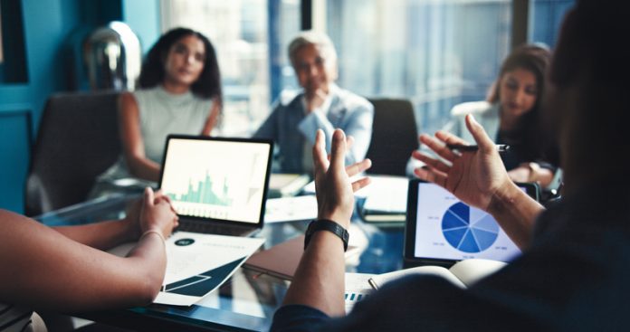 Finance, hands and tablet screen with business people in office boardroom for investment opportunity. Growth, portfolio and presentation with financial team in workplace for wealth management business strategy