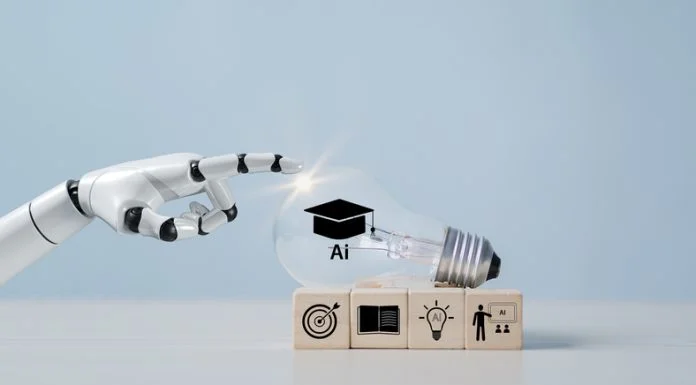 Employers Everywhere are Using AI – but Business Schools aren’t Preparing Students for the Shift A hand with a light bulb, artificial intelligence (AI) learning, educational tools, video-based instruction, digital courses, internet lessons, e-learning concepts.