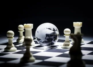 Geographic Strategy - Glass globe on chess board