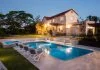 Deep Luxury and Evgeny Skigin - Modern pool with a large house