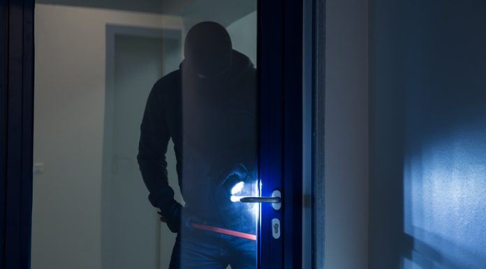 Burglary Myths the Data Kills Full length of burglary using crowbar to open glass door at night