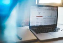 Quality Score: The Invisible Factor that Determines Your Cost Per Click Quality Score and cost per click display on laptop