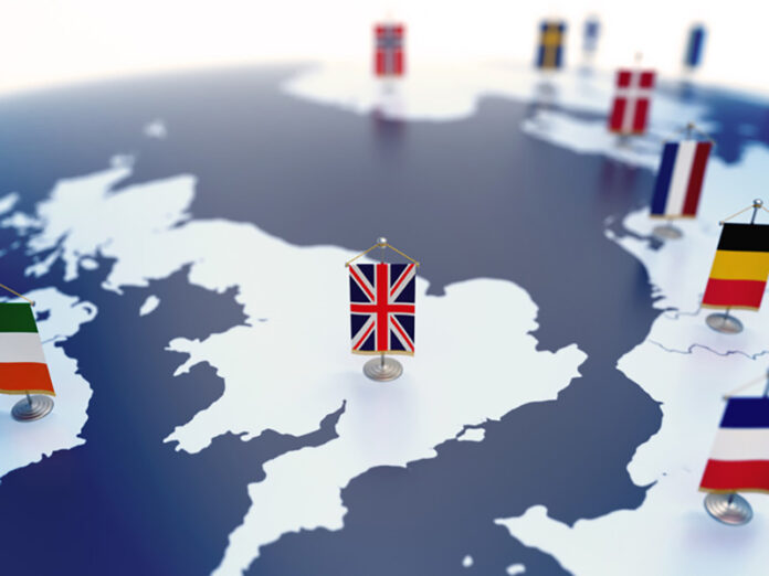 Flag of United Kingdom in focus among other European countries flags UK firms outsourcing compliance in Germany