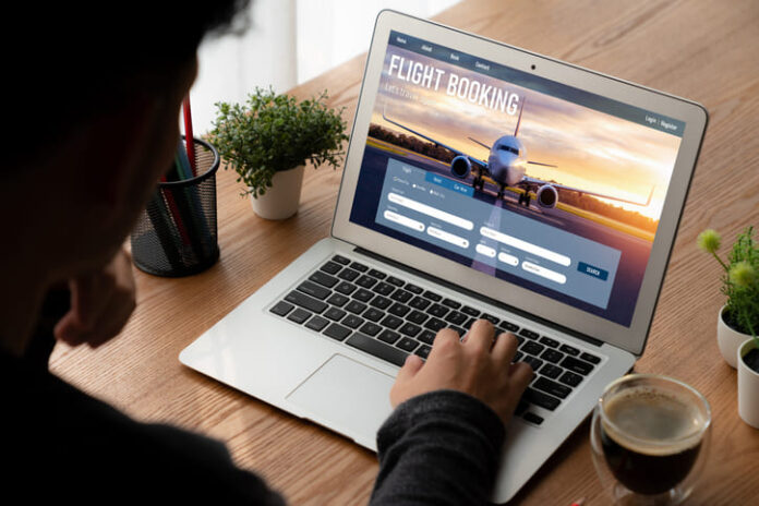 iStock-1483925311 (1) Businessman booking a flight online