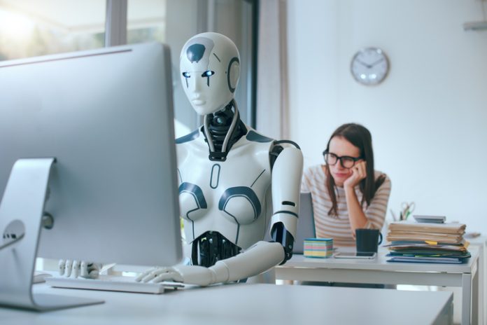 Disappointed stressed woman and AI robot in the office Employee feeling alone with AI in the workplace. Reduce Loneliness concept