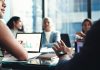 How to Capture Meeting Decisions Without Writing Everything DownĀ Capture Meeting Decisions - business people in office boardroom