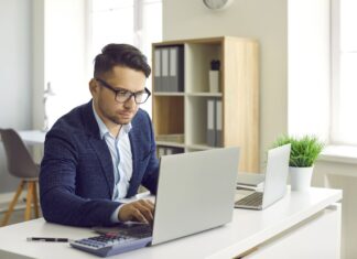 Private Equity Accountancy Firms and What They Mean for Independent Practices Private Equity Accountancy Firms - businessman working on laptop