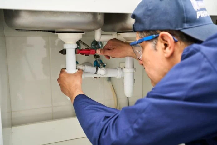 iStock-2267801599 (1) Water Leak Detection Services - Plumber checking sink pipe